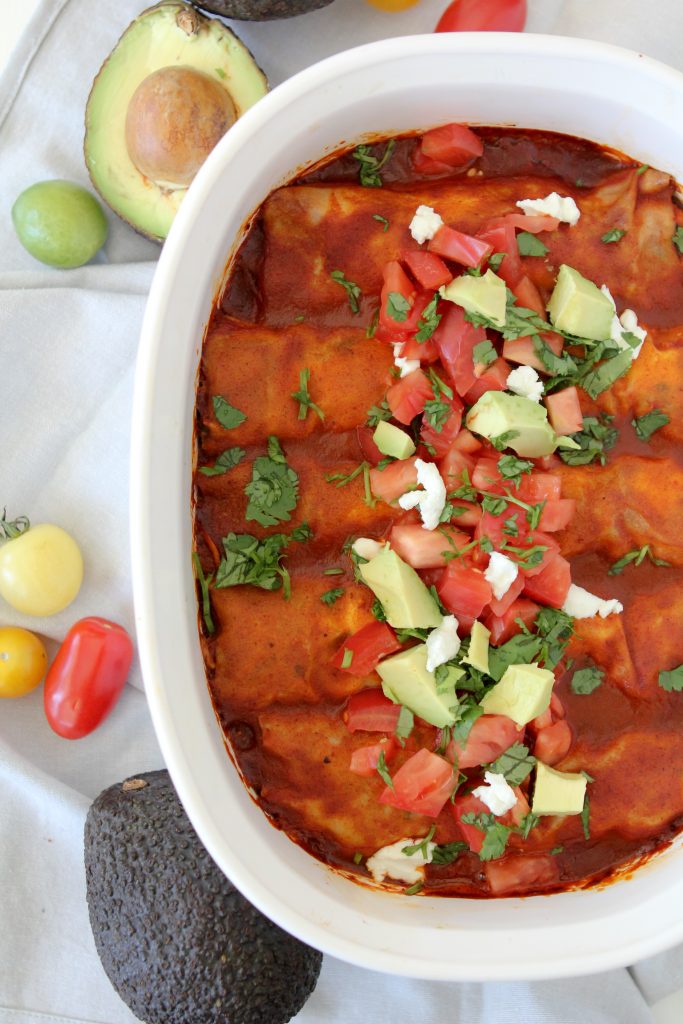 Easy Paleo Chicken Enchiladas from the Whole Smiths. You won't believe what's stuffed inside... cauliflower rice! Grain/gluten-free, paleo friendly. Got to make it!