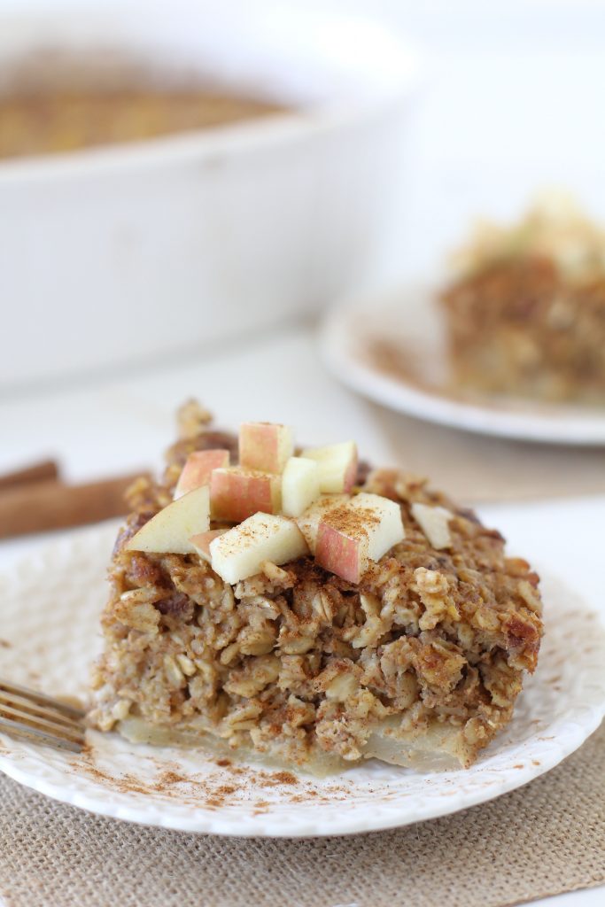 side view of a serving of Healthy Apple and Pumpkin Baked Oatmeal topped with apple cubes