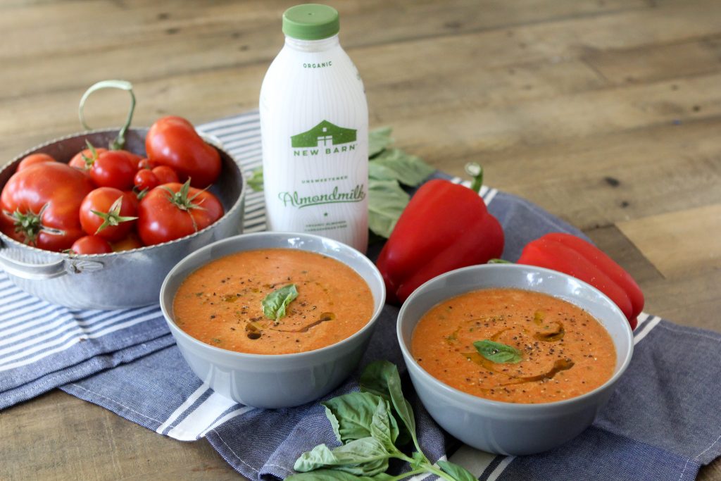 A cozy easy-to-make Whole30 compliant Roasted Tomato + Red Pepper Soup recipe from the Whole Smiths. Great as a side dish or topped with a fried egg or two.