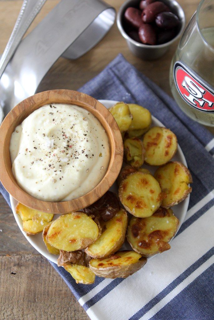 Whole30 compliant Patatas Bravas + Garlic Aioli by the Whole Smiths. Or in other words, the best, crispiest potatoes and garlic dipping sauce you'll ever had.