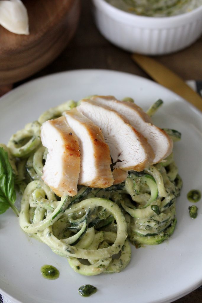 Creamy Pesto Zoodles + Chicken recipe from The Whole Smiths. Not only is this recipe gluten-free and packed with nutrients, it's Whole30 compliant!