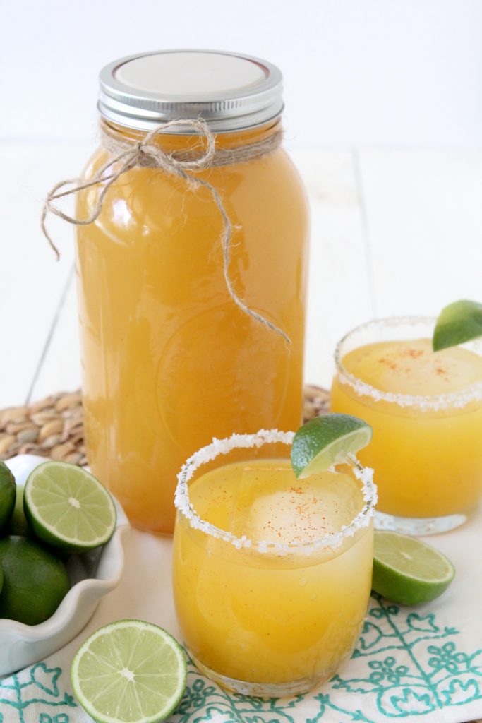 Healthy margaritas served in two glasses on a white table