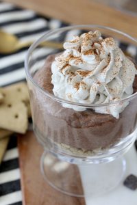 close-up of gluten-free s'mores chia seed parfait with coconut whipped cream
