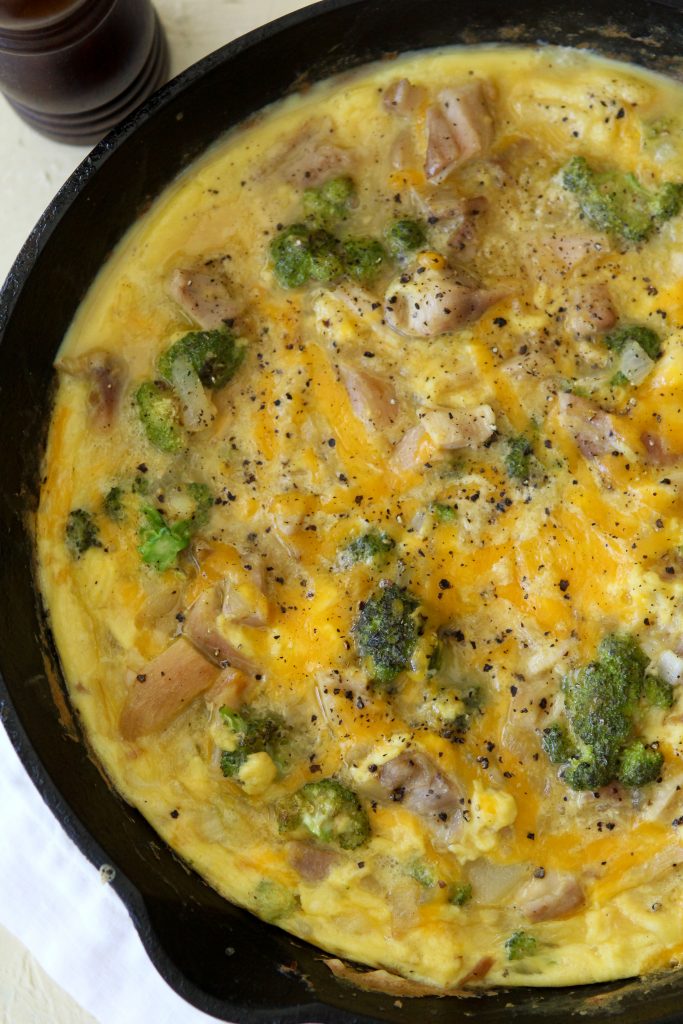 overhead shot of a healthy broccoli cheddar and chicken frittata