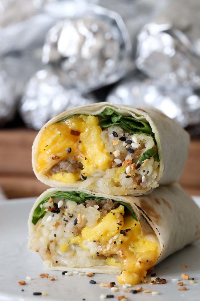 a stacked healthy glutenfree breakfast burrito stacked on a white plate