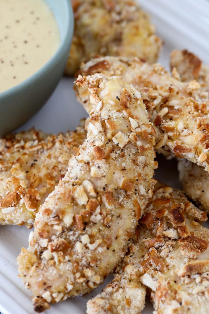 glutenfree baked pretzel crusted chicken tenders served with dairyfree honey mustard dip