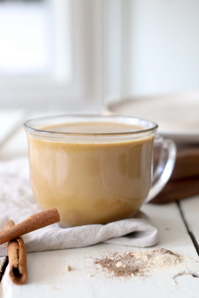 side view of a glass mug filled with dairyfree pumpkin spice chai latte with adaptogens