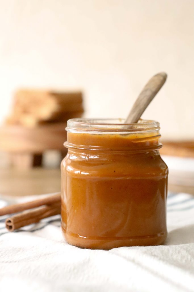 Jar of pumpkin butter made in an instant pot.